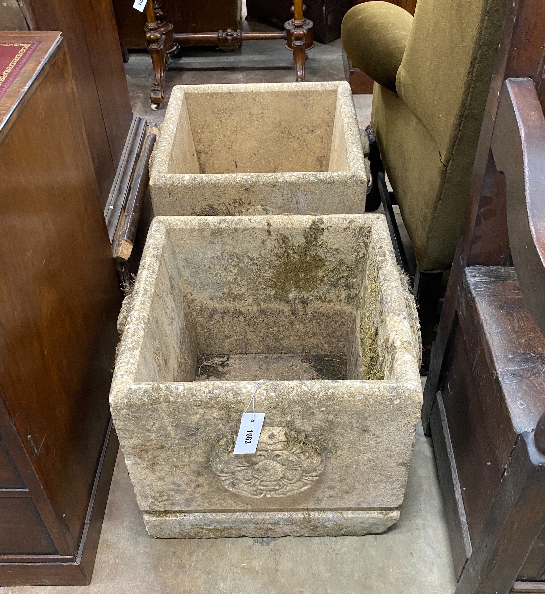 A pair of square reconstituted stone Fleurs de Lys garden planters, width 45cm, height 42cm